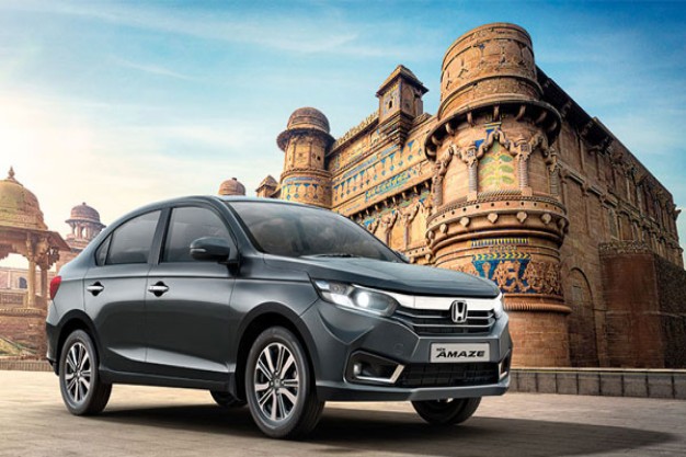 Honda car maintenance checklist being reviewed by a mechanic